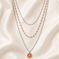Collier triple rang en acier inoxydable – Pendentif Soleil Émaillé Orange