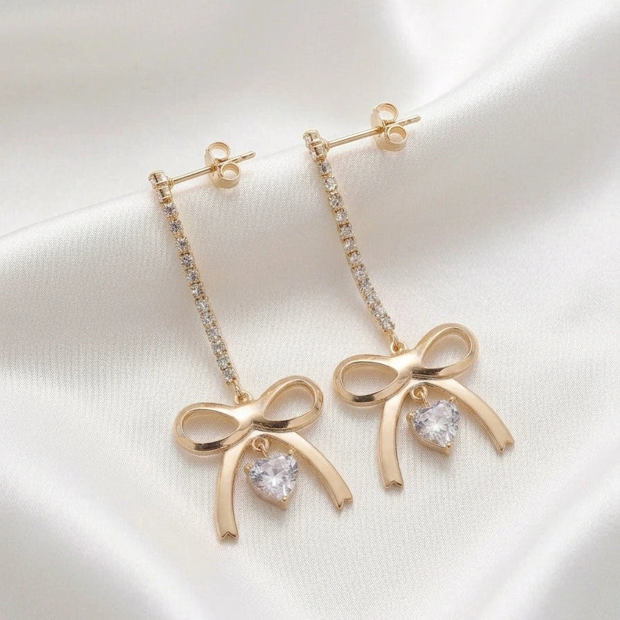 Boucles d'Oreilles Pendantes "Nœud Doré" – Cœur Étincelant