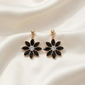 Boucles d'oreilles pendantes fleurs cristaux noirs