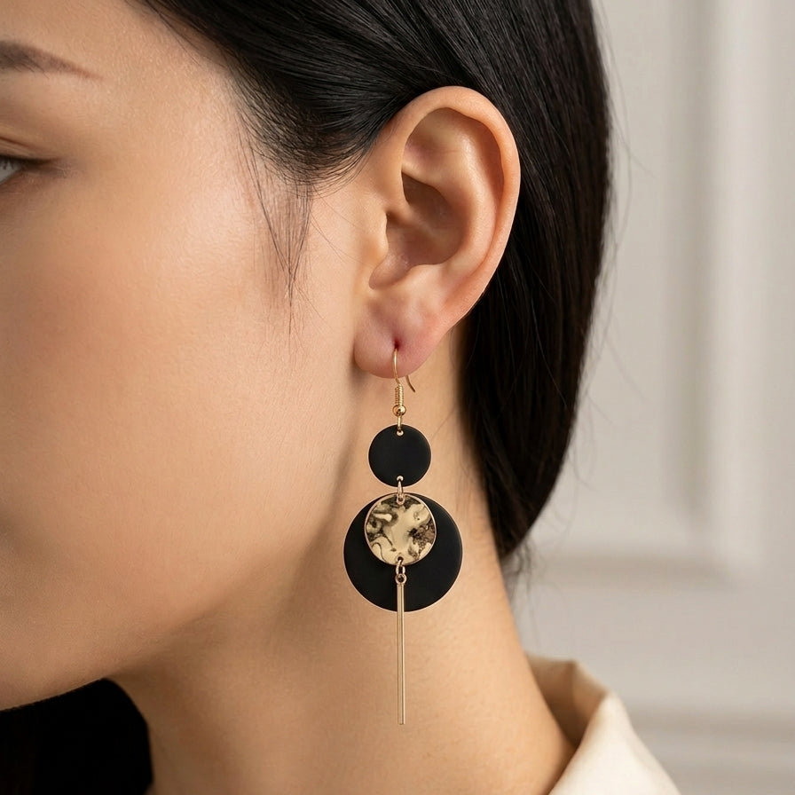 Boucles d'oreilles pendantes graphiques noir et doré