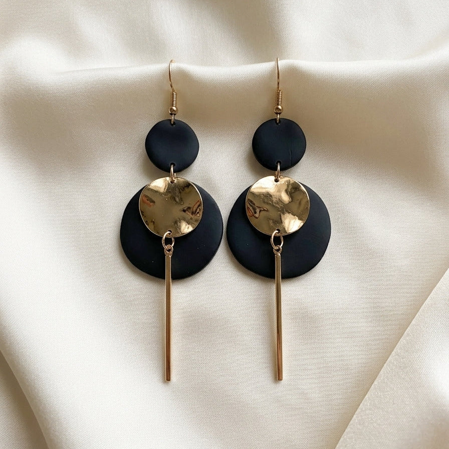 Boucles d'oreilles pendantes graphiques noir et doré