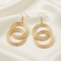 Boucles d'oreilles créoles entrelacées dorées