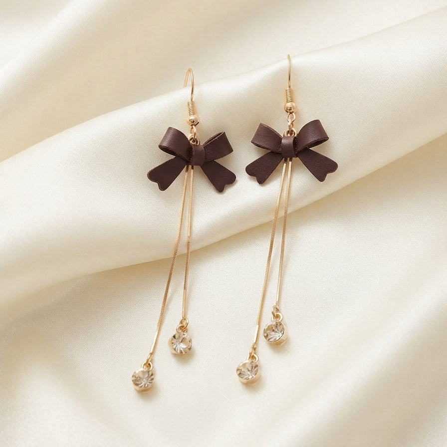Boucles d’oreilles pendantes nœuds marron et pampilles scintillantes